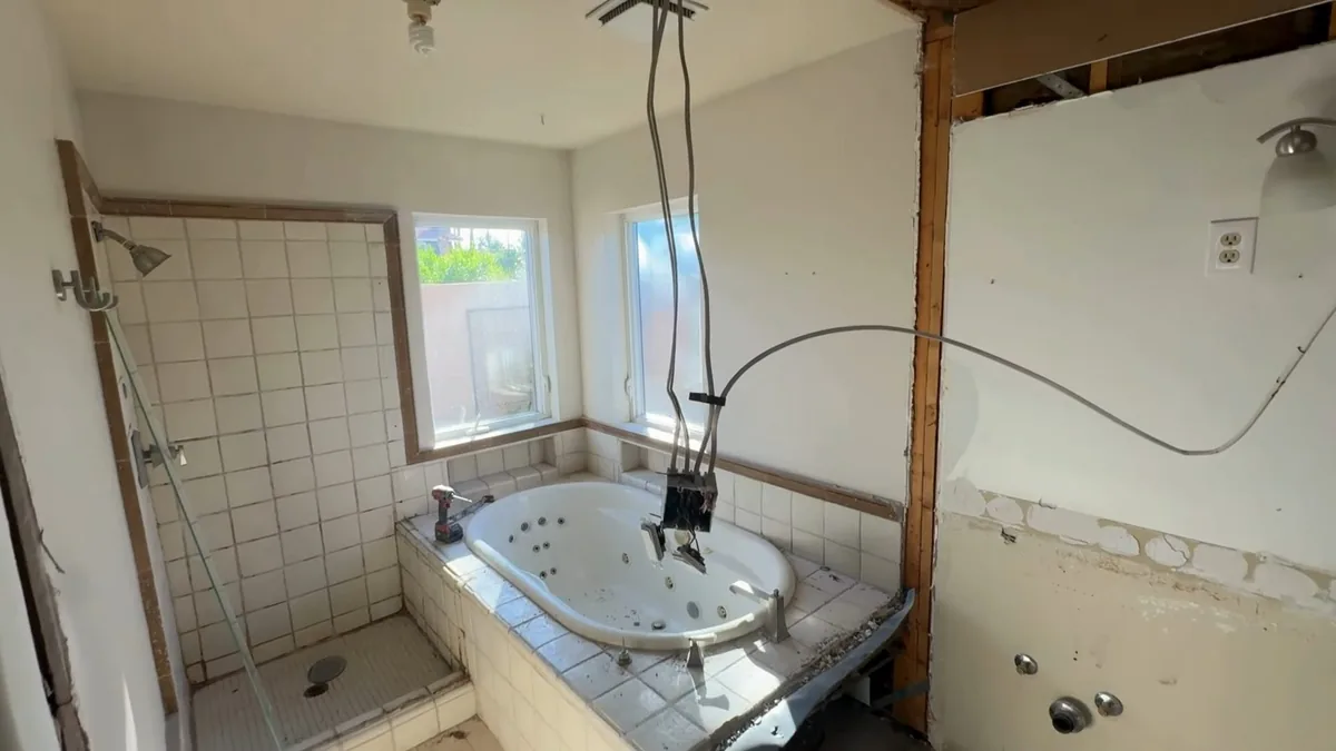 Bathroom remodel rough-in plumbing with open walls and fixtures for Remodel Plumbing in Fountain Valley, CA in Fountain Valley