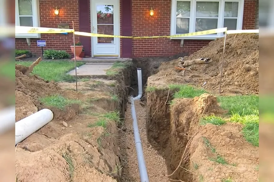 Open trench with new underground pipe laid for replacement for Sewer Line Replacement in Fountain Valley, CA in Fountain Valley during inspection.