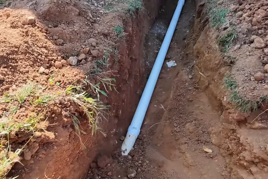 Open trench with new underground pipe laid for replacement for Sewer Line Replacement in Fountain Valley, CA in Fountain Valley near the service area.
