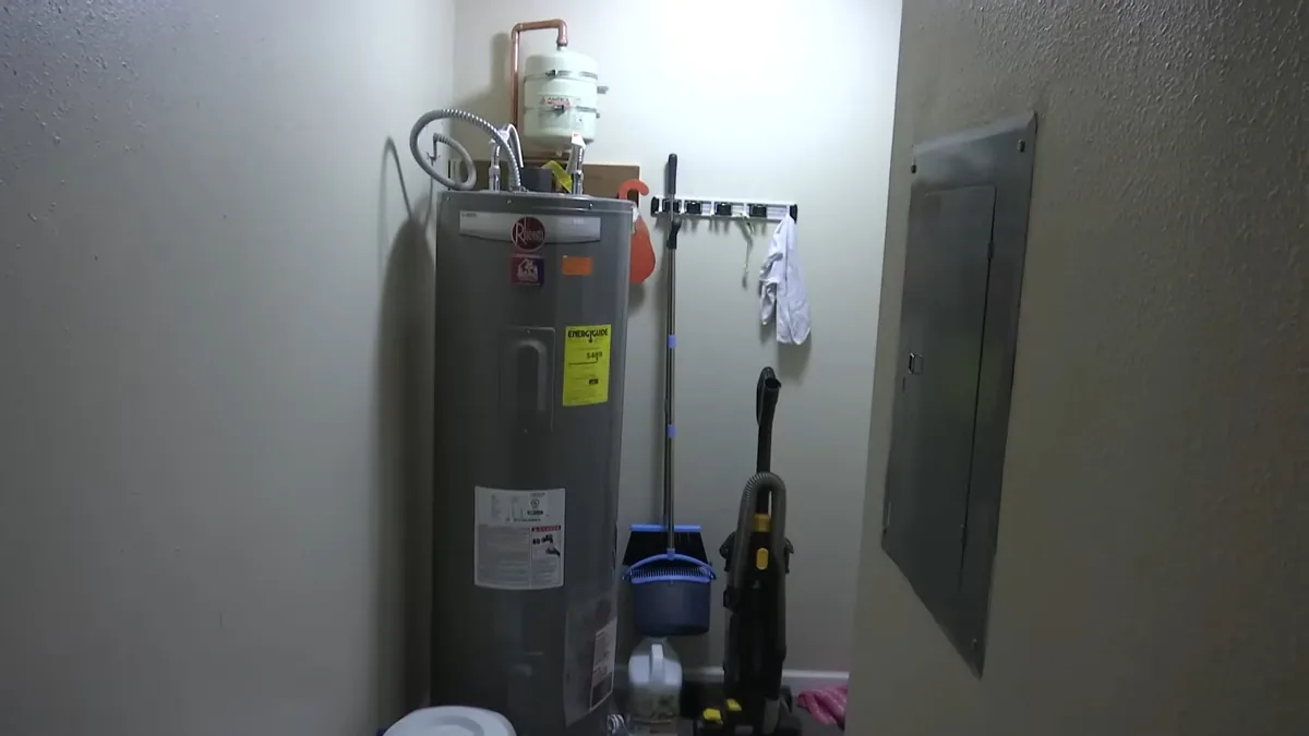Residential water heater inspection at the vent and supply lines for Plumber on Bushard St, Fountain Valley CA in Bushard Street Area