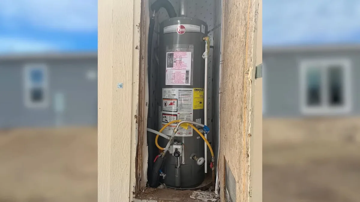 Residential water heater inspection at the vent and supply lines for Plumber on Newland St, Fountain Valley CA in Newland Street Area