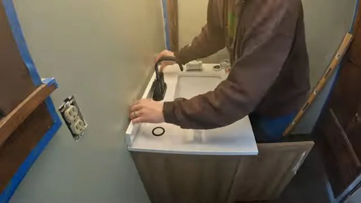 Sink faucet and supply connection being repaired for Plumber in Costa Mesa, CA in Costa Mesa