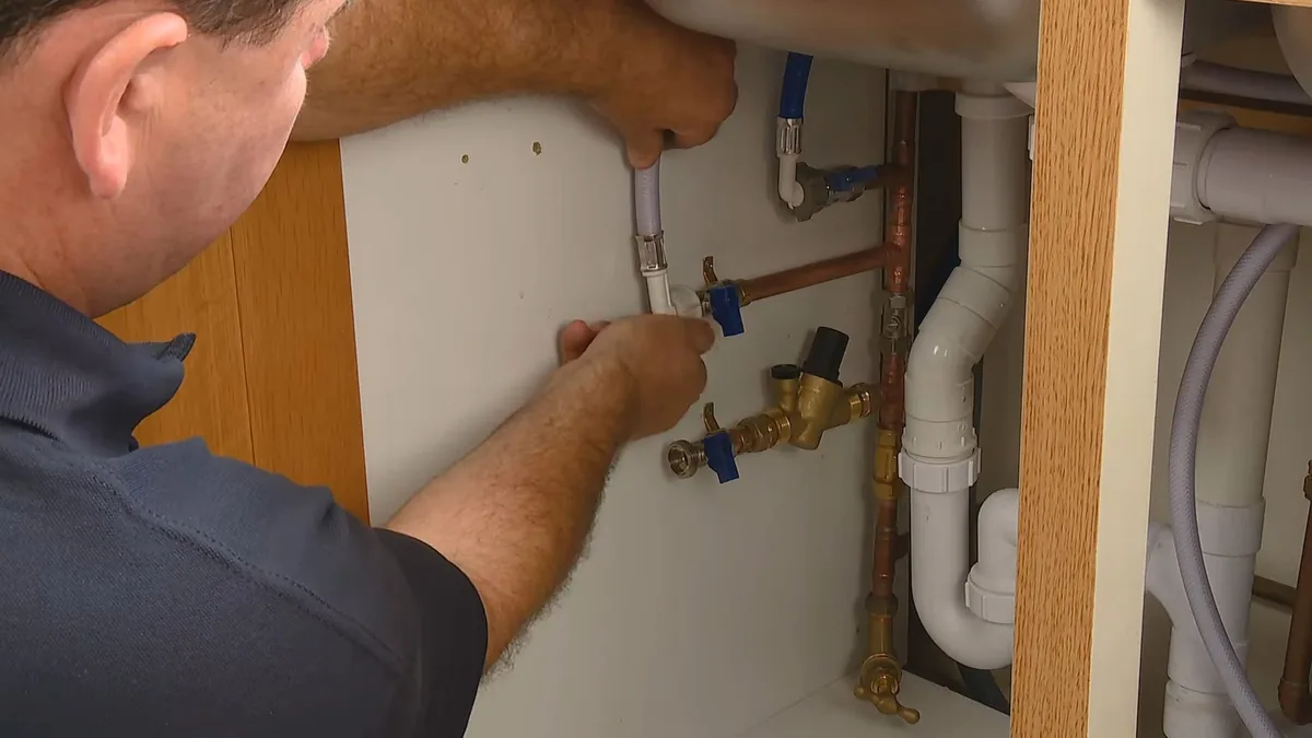 Sink faucet and supply connection being repaired for Plumber on Warner Ave, Fountain Valley CA in Warner Avenue Corridor