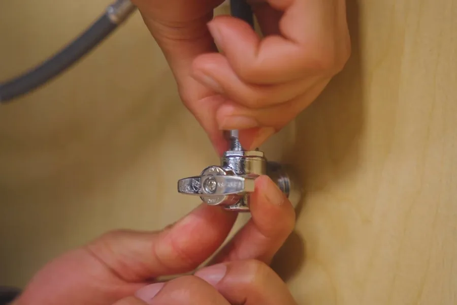 Sink faucet and supply connection being repaired for How to Shut Off Your Water in an Emergency in Fountain Valley