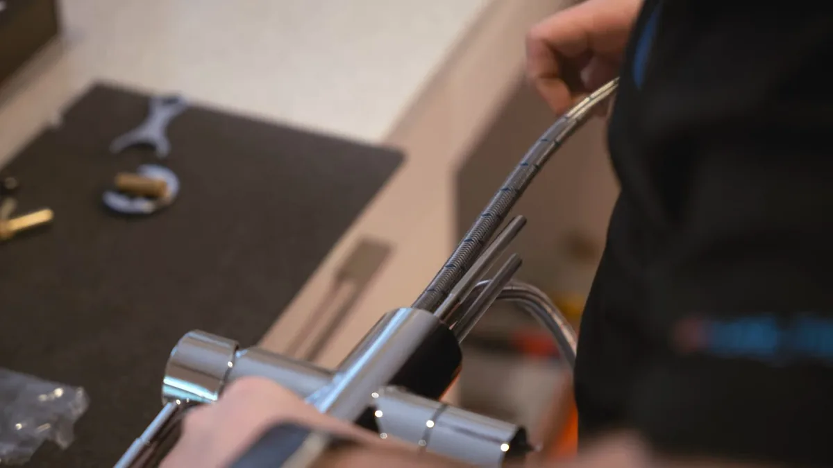 Sink faucet and supply connection being repaired for Plumber in Tustin, CA in Tustin